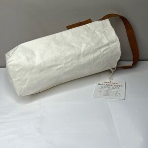 NWT Trader Joe’s washable paper wine bag. Full length 15” with handle. 6.5” wide